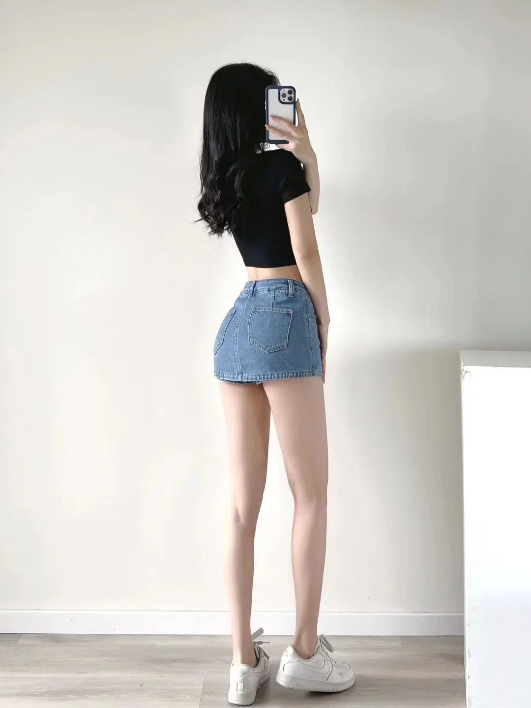 Women's High-Waisted Denim Mini Skirt, designed to offer a sexy and slim fit