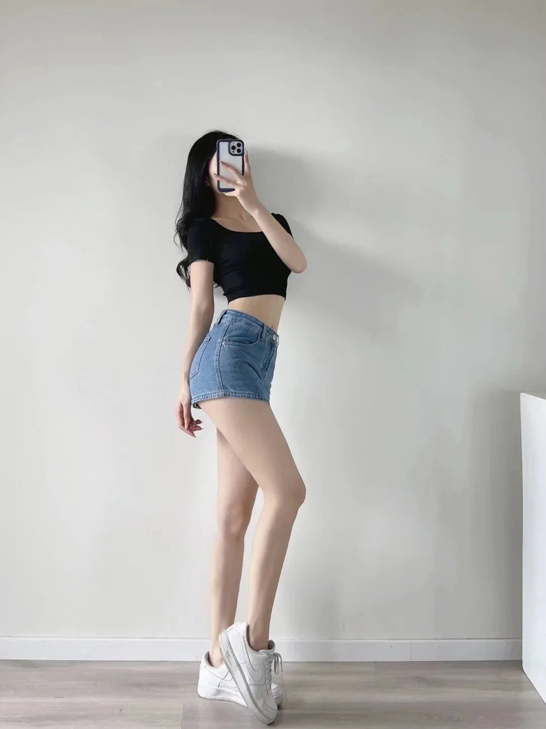 Women's High-Waisted Denim Mini Skirt, designed to offer a sexy and slim fit